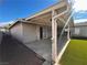 Covered patio with concrete flooring and access to backyard at 730 Brick Dr, Henderson, NV 89002