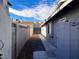 Long, narrow side yard with block wall and gate at 730 Brick Dr, Henderson, NV 89002