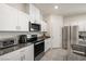 Modern kitchen with stainless steel appliances and granite countertops at 74 Wildcat Ave, Pahrump, NV 89060