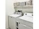 Bright laundry room with washer, dryer, and shelving at 74 Wildcat Ave, Pahrump, NV 89060