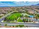 Aerial view showing neighborhood homes, park, and recreational facilities at 7960 Brookside Falls Ct, Las Vegas, NV 89166