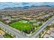 Aerial view of homes, park, and mountains in the background at 7960 Brookside Falls Ct, Las Vegas, NV 89166