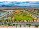 Community park with large green space, playground, and surrounding homes at 7960 Brookside Falls Ct, Las Vegas, NV 89166