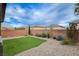 Landscaped backyard with artificial turf and gravel at 7960 Brookside Falls Ct, Las Vegas, NV 89166