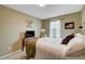 Bright bedroom featuring a queen-size bed and natural light at 7960 Brookside Falls Ct, Las Vegas, NV 89166