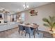 Dining area with wooden table, gray chairs, and hardwood floors at 7960 Brookside Falls Ct, Las Vegas, NV 89166