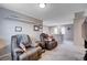 Relaxing Gathering room featuring two recliners and built-in shelving at 7960 Brookside Falls Ct, Las Vegas, NV 89166