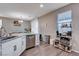 Modern kitchen with white cabinets and granite countertops at 7960 Brookside Falls Ct, Las Vegas, NV 89166