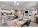 Open kitchen with island, white cabinets, and granite countertops at 7960 Brookside Falls Ct, Las Vegas, NV 89166