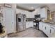 Modern kitchen with white cabinets and stainless steel appliances at 7960 Brookside Falls Ct, Las Vegas, NV 89166