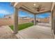 Covered patio, artificial turf, and hot tub at 8130 Skye Sweep St, Las Vegas, NV 89166