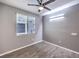 Bright bedroom with hardwood floors and a ceiling fan at 8130 Skye Sweep St, Las Vegas, NV 89166