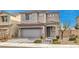 Two-story house with gray siding and a gray garage door at 8130 Skye Sweep St, Las Vegas, NV 89166