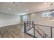 Spacious loft area with wood-look floors and modern railing at 8130 Skye Sweep St, Las Vegas, NV 89166