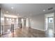 Open loft with multiple doors and a modern chandelier at 8130 Skye Sweep St, Las Vegas, NV 89166