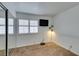 Bright bedroom featuring neutral carpeting and a mirrored closet at 8424 Oyster Dr, Las Vegas, NV 89128