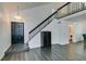 Entryway with staircase, chandelier, and dark wood cabinet at 8424 Oyster Dr, Las Vegas, NV 89128