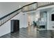 Living area with staircase, dark wood cabinet and view of dining area at 8424 Oyster Dr, Las Vegas, NV 89128