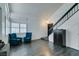 Living room with two blue armchairs and view of entryway at 8424 Oyster Dr, Las Vegas, NV 89128