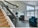 Living area with gray sectional sofa and view of staircase at 8424 Oyster Dr, Las Vegas, NV 89128