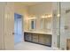 Double vanity bathroom with gray cabinets and a separate shower at 8466 Lambert Dr, Las Vegas, NV 89147