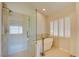 Elegant bathroom with soaking tub, walk-in shower, and updated fixtures at 8466 Lambert Dr, Las Vegas, NV 89147