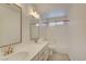 Bathroom with double sinks, updated vanity, and tiled shower/tub combo at 8466 Lambert Dr, Las Vegas, NV 89147