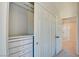 White closet with drawers and hanging rod at 8466 Lambert Dr, Las Vegas, NV 89147