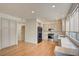 Modern kitchen with white cabinets, quartz countertops, and stainless steel appliances at 8466 Lambert Dr, Las Vegas, NV 89147