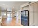 Modern kitchen with white cabinets, quartz countertops, and stainless steel appliances at 8466 Lambert Dr, Las Vegas, NV 89147