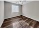 Well-lit bedroom featuring hardwood floors and window coverings at 866 Austin Peak Ct, Las Vegas, NV 89110