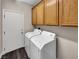 Laundry room with washer, dryer, and upper cabinets at 866 Austin Peak Ct, Las Vegas, NV 89110