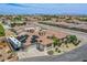 Aerial view of house with solar panels and distant mountain views at 8965 S Tenaya Way, Las Vegas, NV 89113