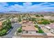 Aerial view of house with mountain views and a large backyard at 8965 S Tenaya Way, Las Vegas, NV 89113