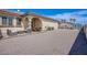 Spacious backyard with gravel, patio furniture, and a shed at 8965 S Tenaya Way, Las Vegas, NV 89113