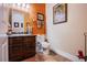 Small bathroom with toilet and dark wood vanity at 8965 S Tenaya Way, Las Vegas, NV 89113