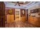 Bedroom with ensuite bath, hardwood floors, and ample dresser storage at 8965 S Tenaya Way, Las Vegas, NV 89113