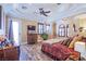 Bedroom with hardwood floors, a king-size bed, and ceiling fan at 8965 S Tenaya Way, Las Vegas, NV 89113