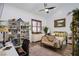 Bedroom with a desk, bookcase, and a chaise lounge at 8965 S Tenaya Way, Las Vegas, NV 89113