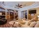 Luxurious main bedroom featuring hardwood floors, fireplace, and ensuite bathroom at 8965 S Tenaya Way, Las Vegas, NV 89113