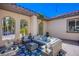 Relaxing outdoor patio with comfortable seating and a fountain at 8965 S Tenaya Way, Las Vegas, NV 89113