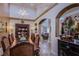 Elegant dining room with a large wooden table and chandelier at 8965 S Tenaya Way, Las Vegas, NV 89113