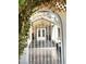 Elegant gated entryway leading to the front door of the house at 8965 S Tenaya Way, Las Vegas, NV 89113