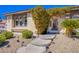 Inviting front entrance with a walkway and lush landscaping at 8965 S Tenaya Way, Las Vegas, NV 89113