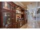 Elegant hallway with built-in wooden display cabinets at 8965 S Tenaya Way, Las Vegas, NV 89113