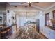 Modern kitchen featuring a long granite island and white cabinets at 8965 S Tenaya Way, Las Vegas, NV 89113