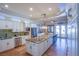 Spacious kitchen with a large island and green tile backsplash at 8965 S Tenaya Way, Las Vegas, NV 89113