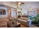 Spacious living room featuring a light beige couch and high ceilings at 8965 S Tenaya Way, Las Vegas, NV 89113