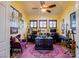 Bright home office with two work stations and purple accent chair at 8965 S Tenaya Way, Las Vegas, NV 89113