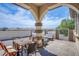 Covered patio with seating area, offering an outdoor dining space at 8965 S Tenaya Way, Las Vegas, NV 89113